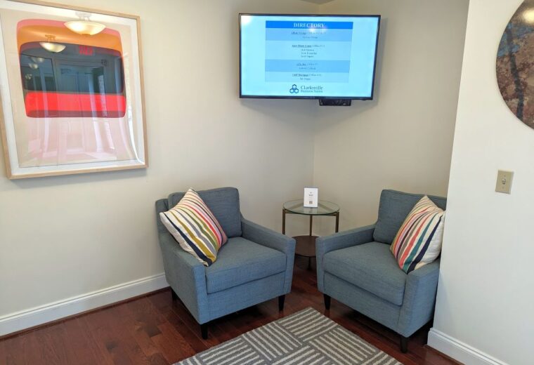 Office Waiting Room With Sofas & Directory Display on TV
